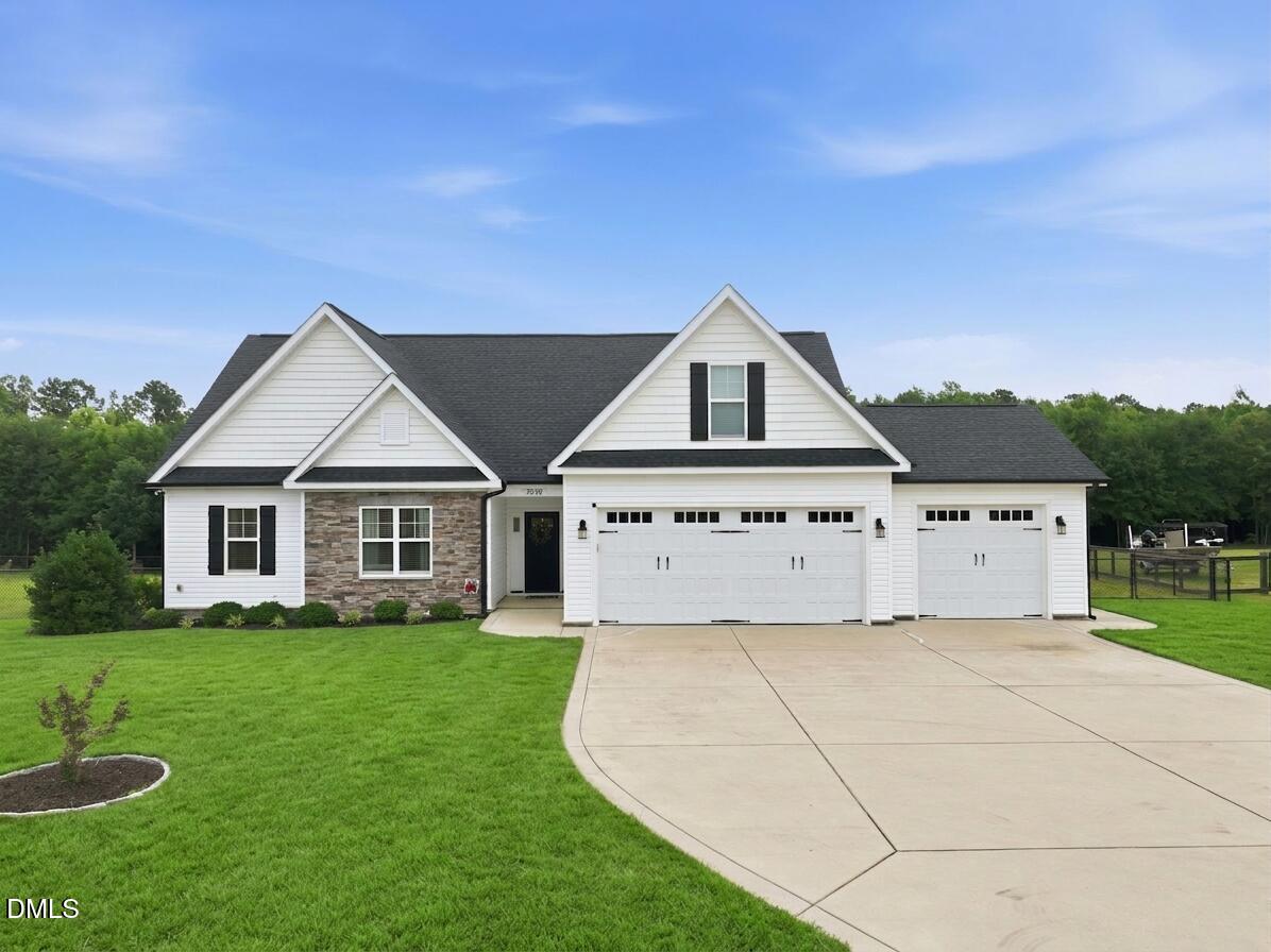 5098 Spring Hill Church Road Lillington, NC 27546 - Photo 1 of 36 a front view of a house with garden