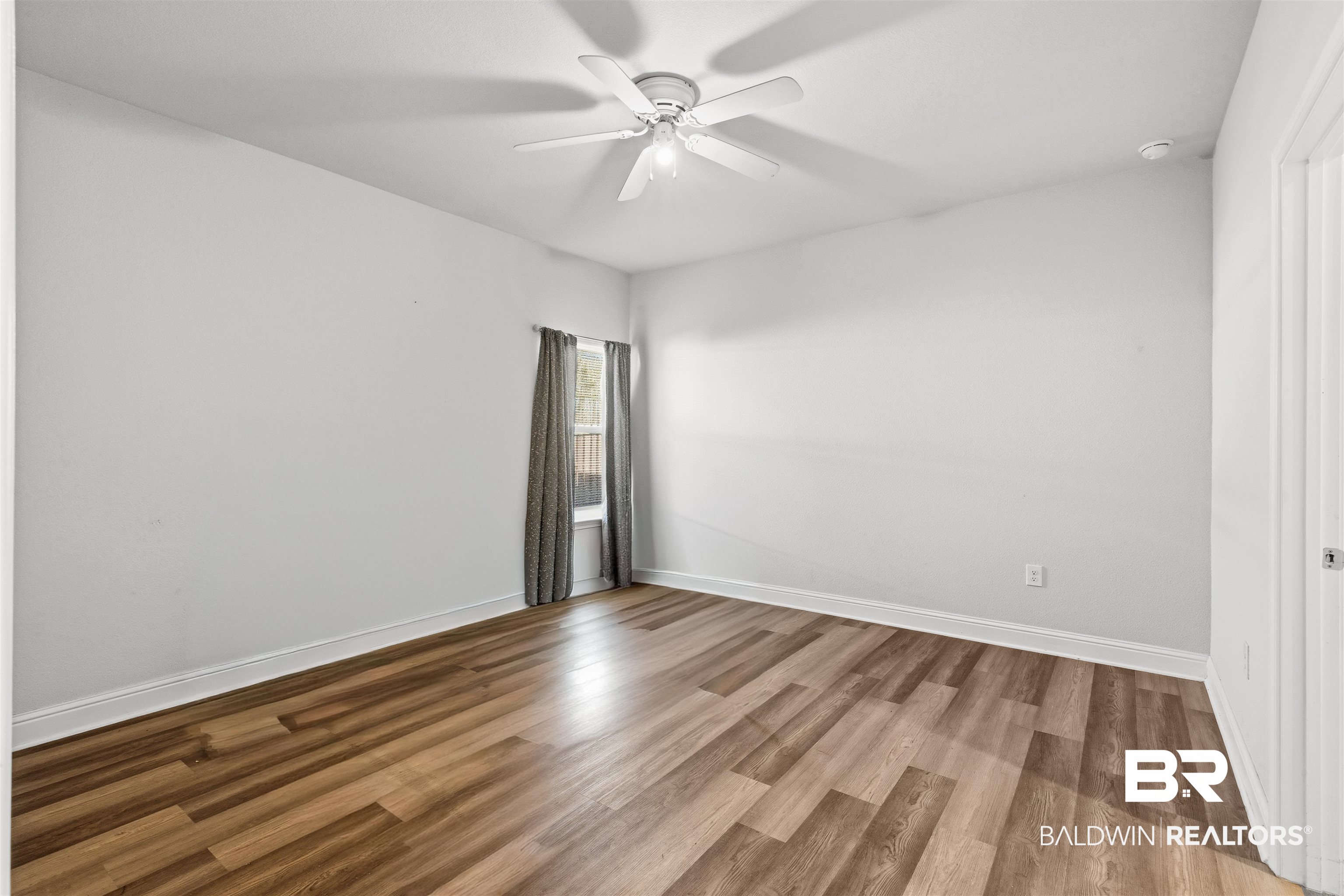 485 Shepard Street Gulf Shores, AL 36542 - Photo 27 of 53 In-Law Suite bedroom with wood finished floors and a ceiling fan