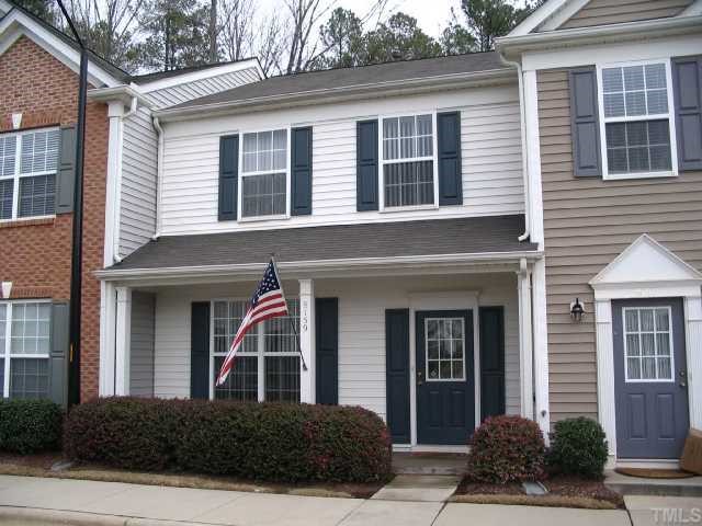 8159 Rhiannon Road Raleigh, NC 27613 - Photo 1 of 12 a view of a brick house with a large windows