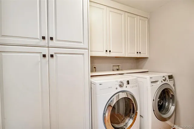 a view of hallway with washer and dryer