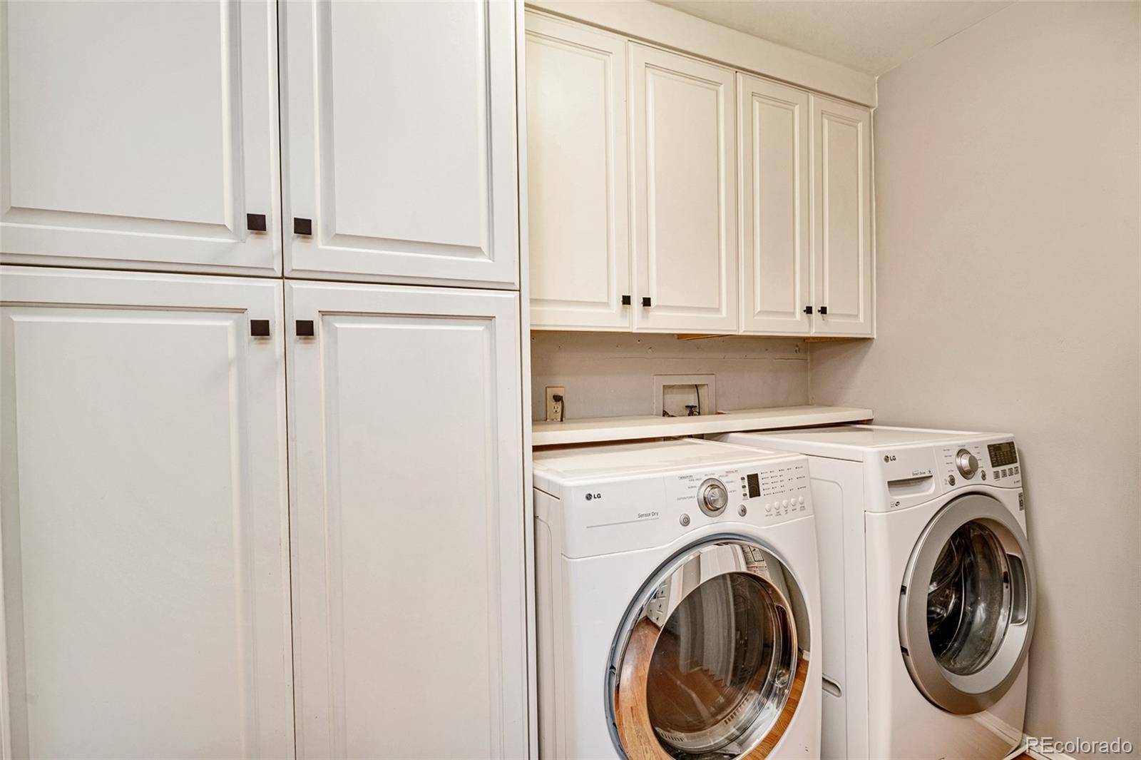 1250 Emporia Street Aurora, CO 80010 - Photo 14 of 33 a view of hallway with washer and dryer