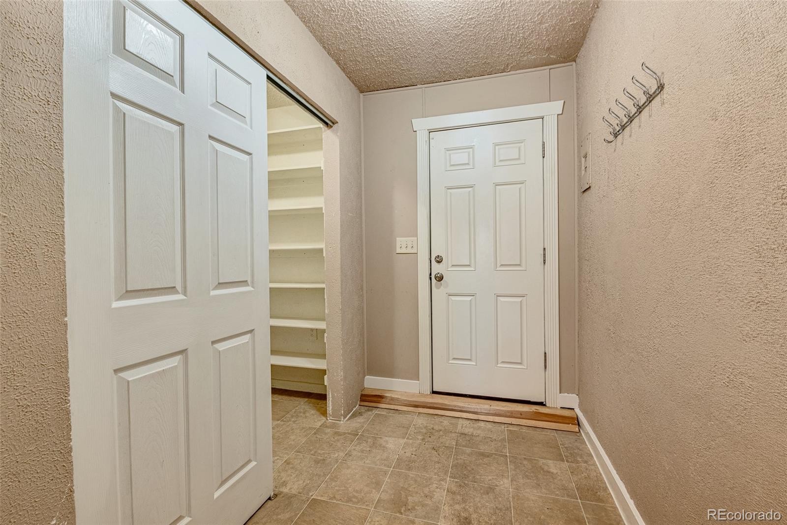 1250 Emporia Street Aurora, CO 80010 - Photo 22 of 33 a view of an empty room with closet area