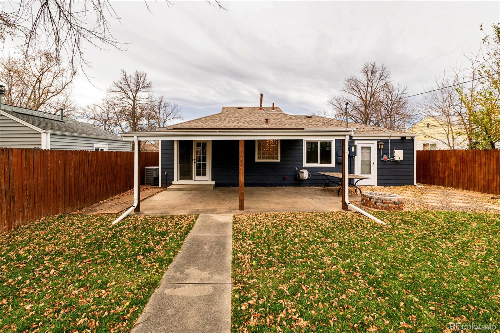 1250 Emporia Street Aurora, CO 80010 - Photo 26 of 33 a front view of a house with a yard