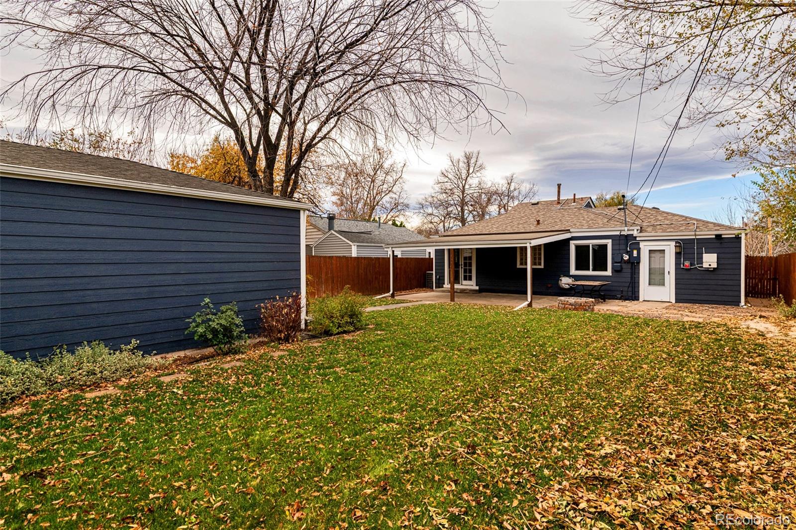 1250 Emporia Street Aurora, CO 80010 - Photo 28 of 33 a view of a house with a large window and a yard