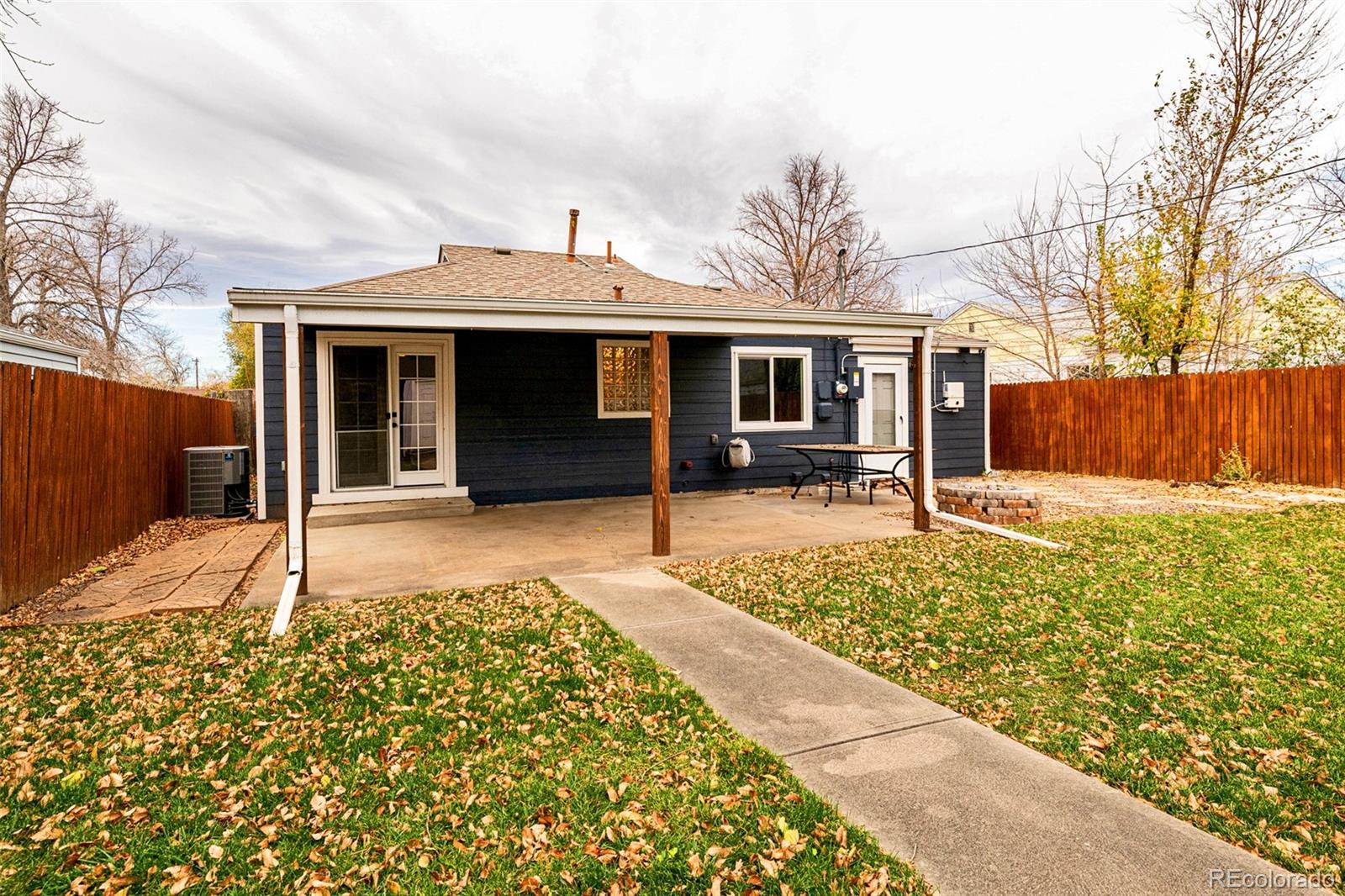 1250 Emporia Street Aurora, CO 80010 - Photo 29 of 33 a house with trees in the background