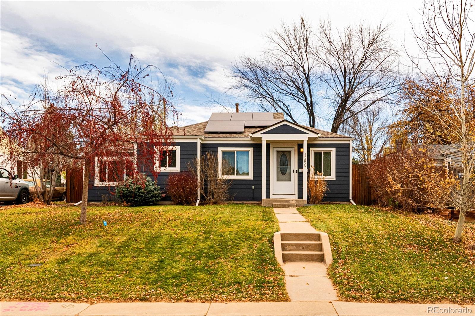 1250 Emporia Street Aurora, CO 80010 - Photo 32 of 33 a front view of a house with a yard