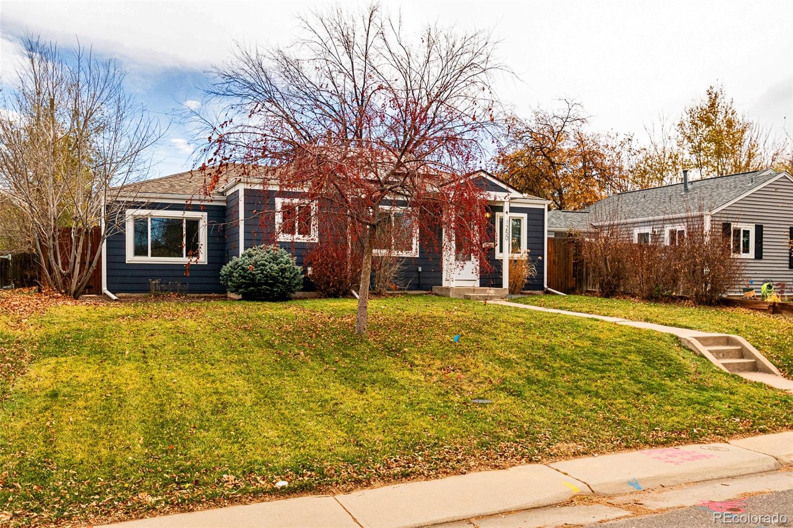 1250 Emporia Street Aurora, CO 80010 - Photo 33 of 33 a front view of house with yard and trees around