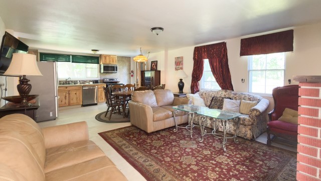 597 Greenough Road Hartwick, NY 13326 - Photo 6 of 19 First floor living room looking to kitchen