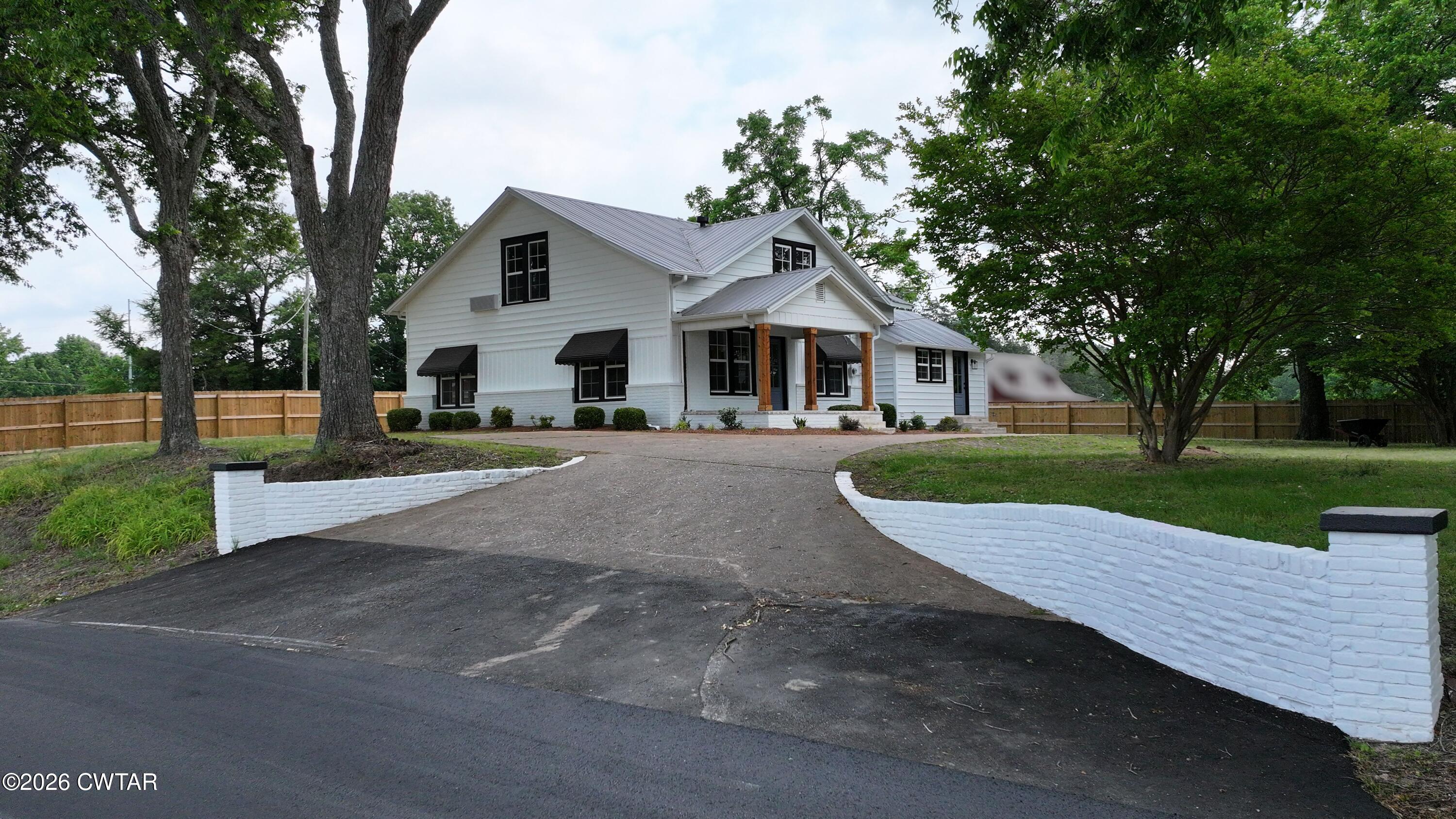 16 Manner Frank Road Milan, TN 38358 - Photo 2 of 25 a view of a house with a yard and large tree