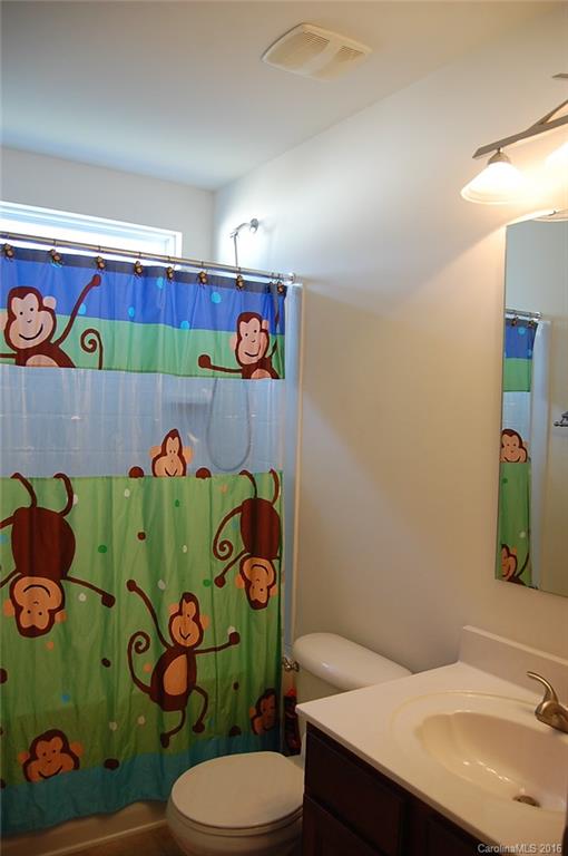 5831 Ringneck Road Charlotte, NC 28216 - Photo 19 of 20 a bathroom with a sink mirror and vanity