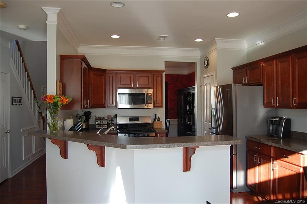 5831 Ringneck Road Charlotte, NC 28216 - Photo 4 of 20 a kitchen with stainless steel appliances granite countertop a refrigerator and a sink