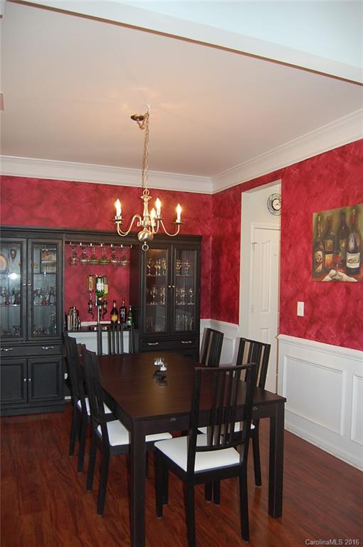 5831 Ringneck Road Charlotte, NC 28216 - Photo 5 of 20 a view of a dining room with furniture and wooden floor