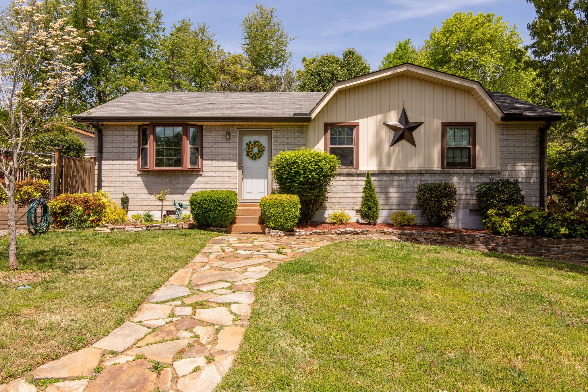 7813 Chester Road Fairview, TN 37062 - Photo 1 of 23 a front view of a house with yard and green space