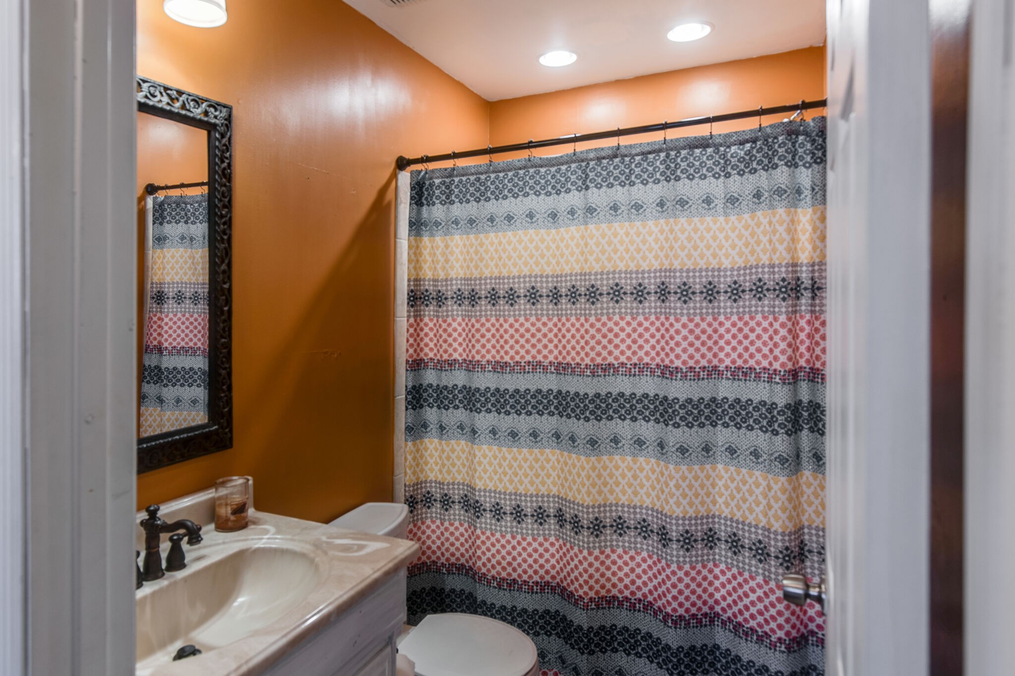 7813 Chester Road Fairview, TN 37062 - Photo 14 of 23 a bathroom with a sink toilet and mirror