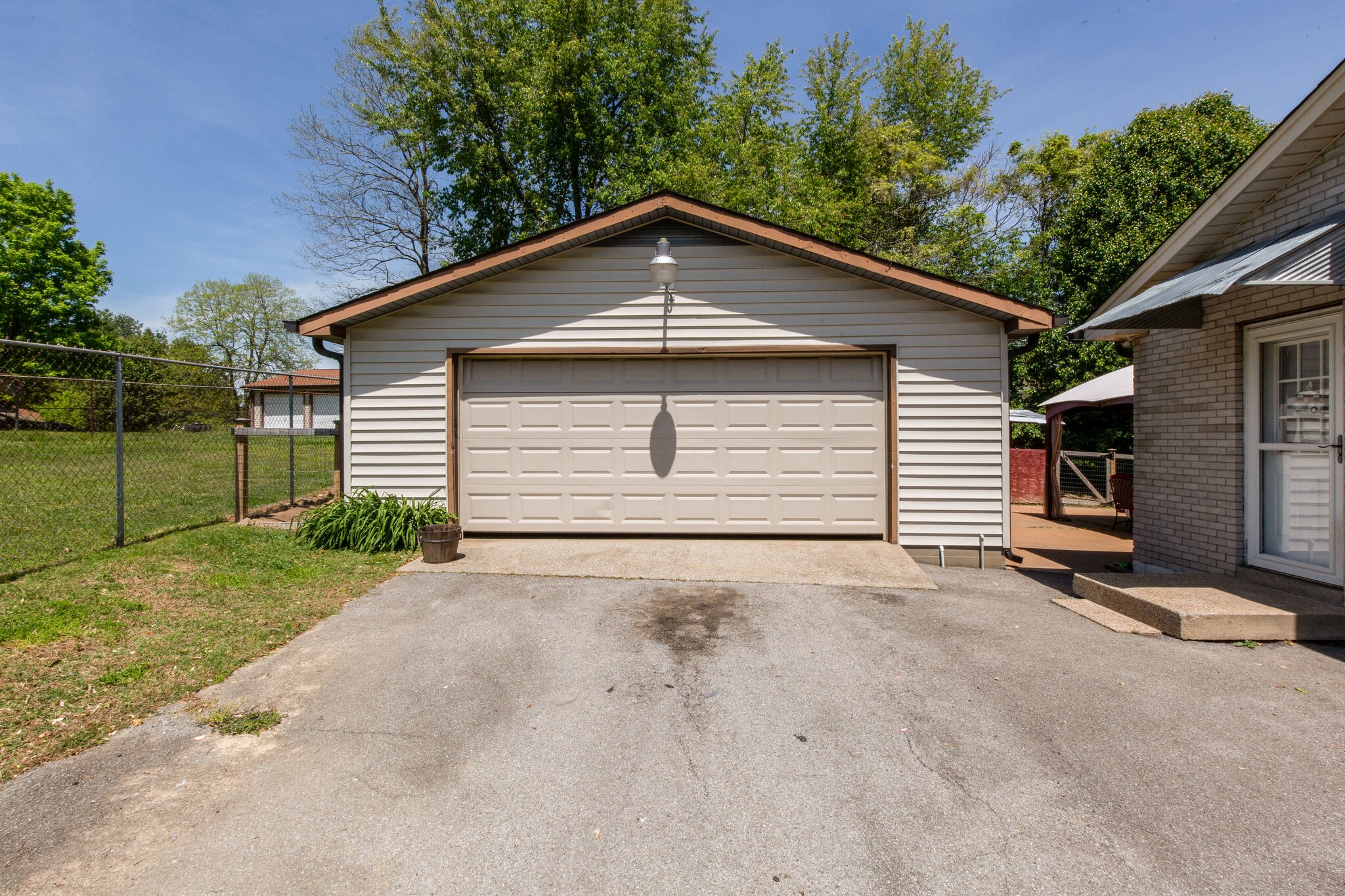 7813 Chester Road Fairview, TN 37062 - Photo 23 of 23 a view of a house with a garage and yard