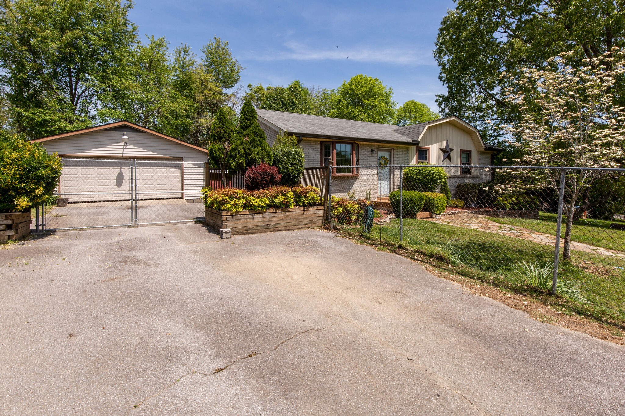 7813 Chester Road Fairview, TN 37062 - Photo 4 of 23 a front view of a house with garden