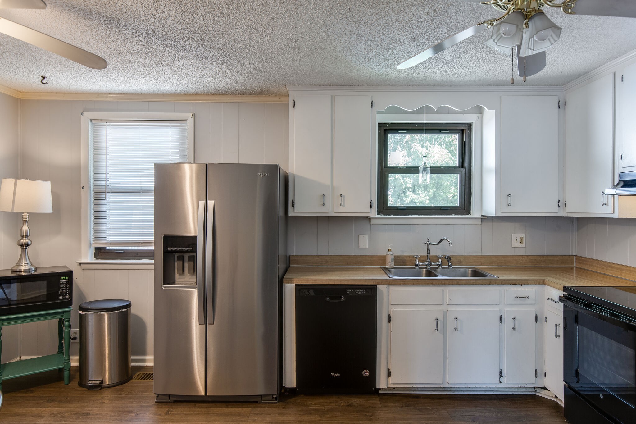 7813 Chester Road Fairview, TN 37062 - Photo 8 of 23 a kitchen with a sink stainless steel appliances and cabinets
