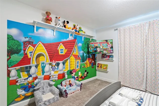 a bedroom with a bed and a couch