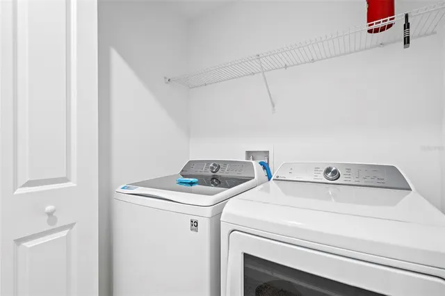 a view of a room with wooden floor and pool table