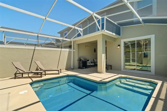 a view of multiple houses with a big yard