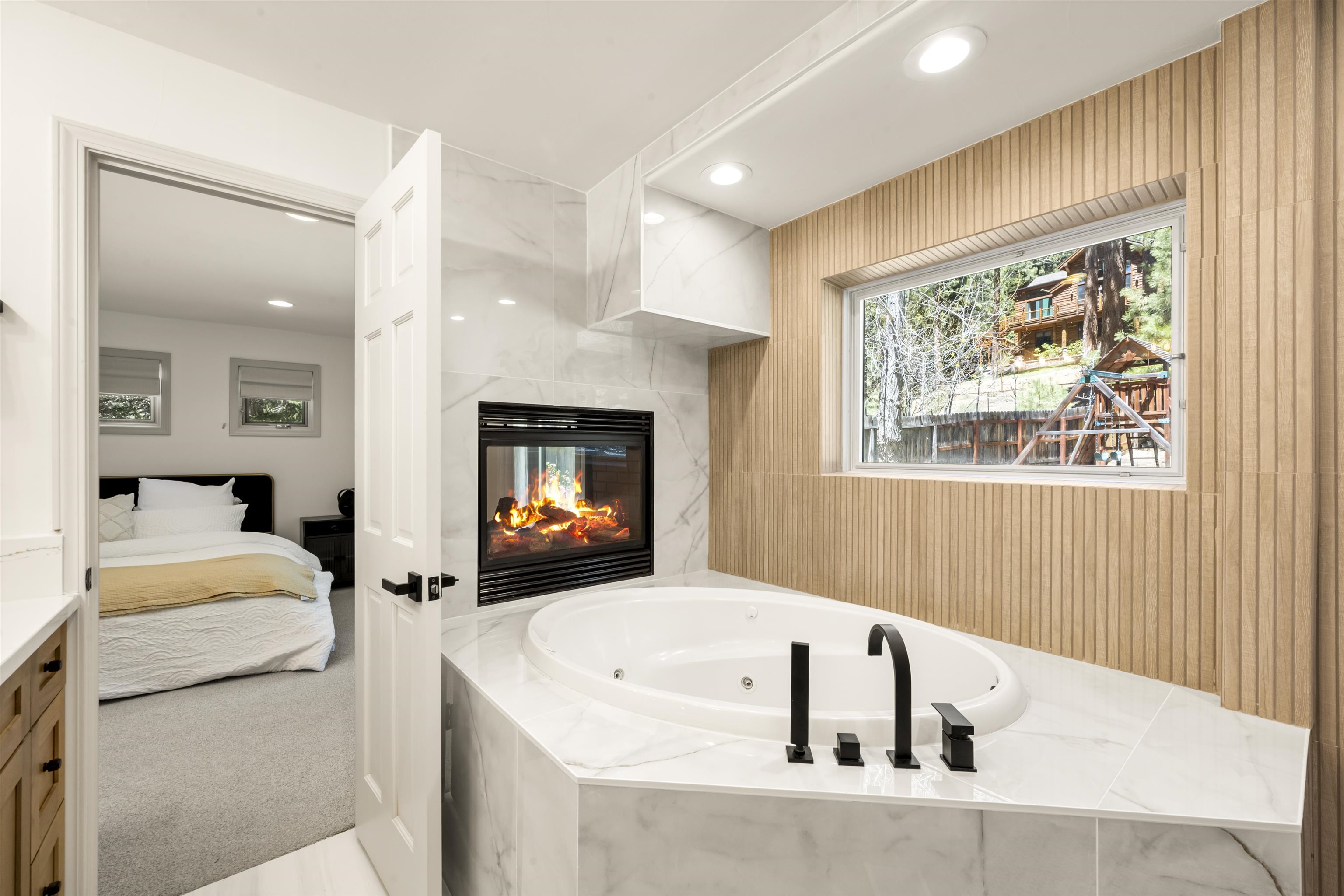 325 Winding Way Incline Village, NV 89451 - Photo 12 of 28 a bathroom with a tub a sink and a mirror