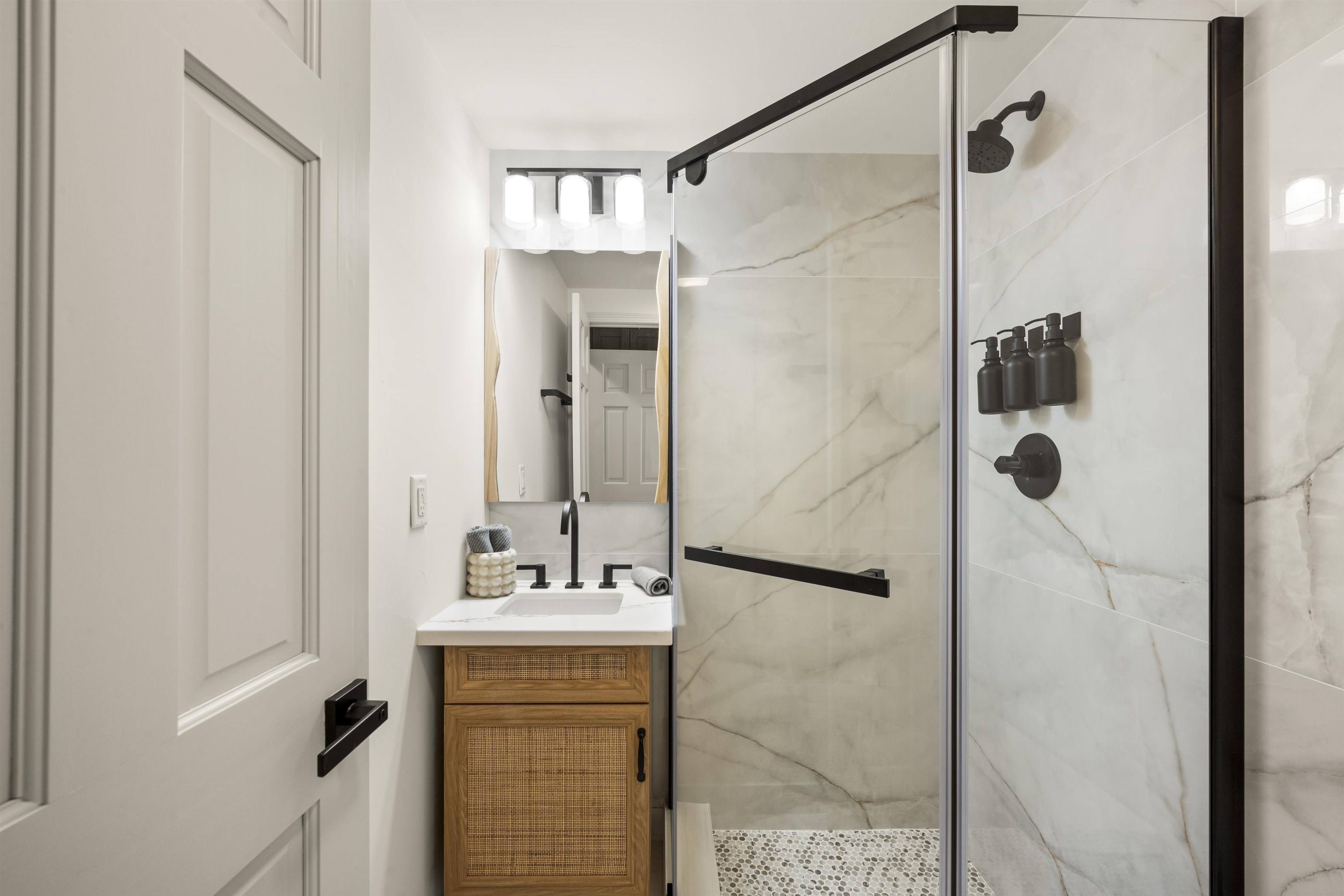 325 Winding Way Incline Village, NV 89451 - Photo 14 of 28 a bathroom with a shower sink and mirror