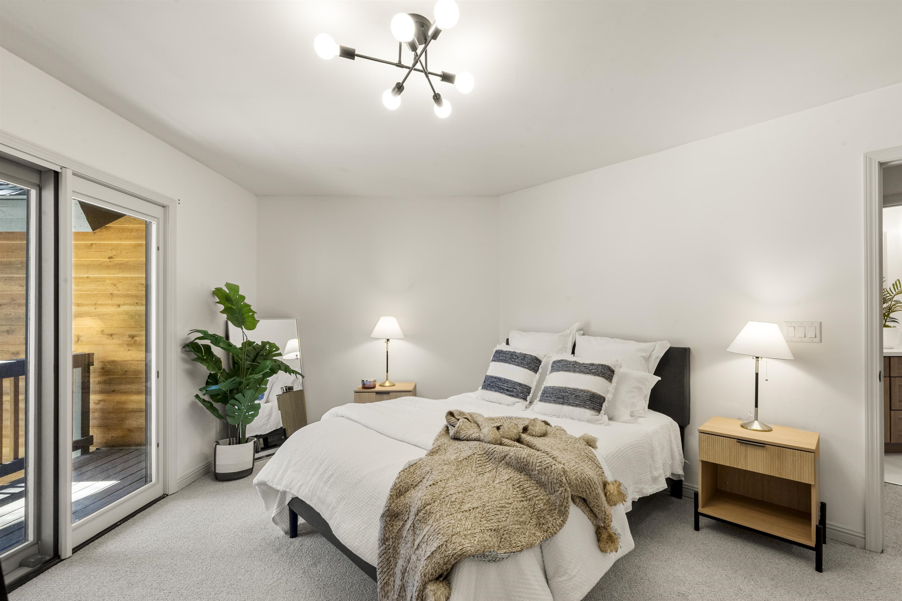 325 Winding Way Incline Village, NV 89451 - Photo 18 of 28 a bedroom with a bed and a potted plant