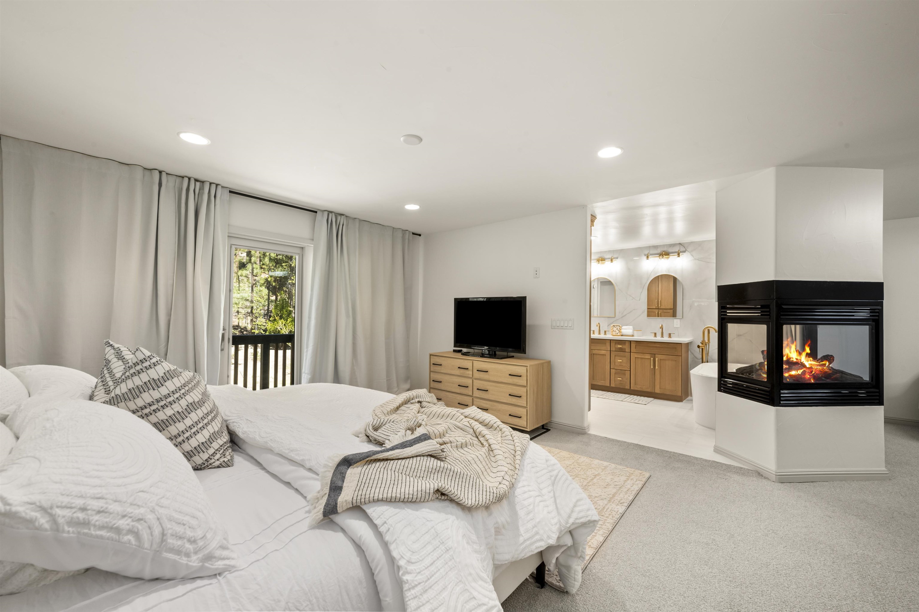 325 Winding Way Incline Village, NV 89451 - Photo 20 of 28 a bedroom with a bed and a television in it