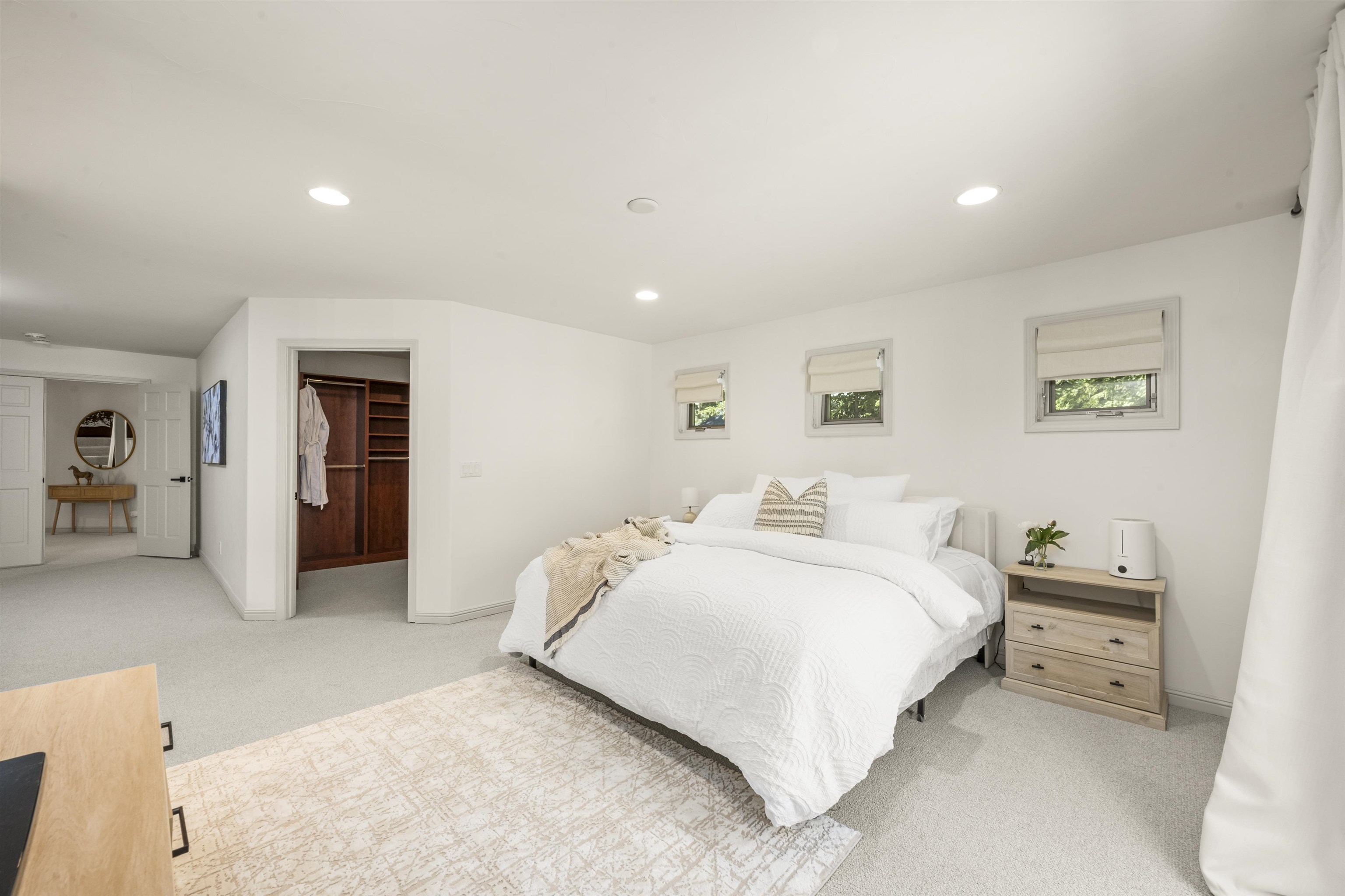 325 Winding Way Incline Village, NV 89451 - Photo 24 of 28 a spacious bedroom with a bed and a couch