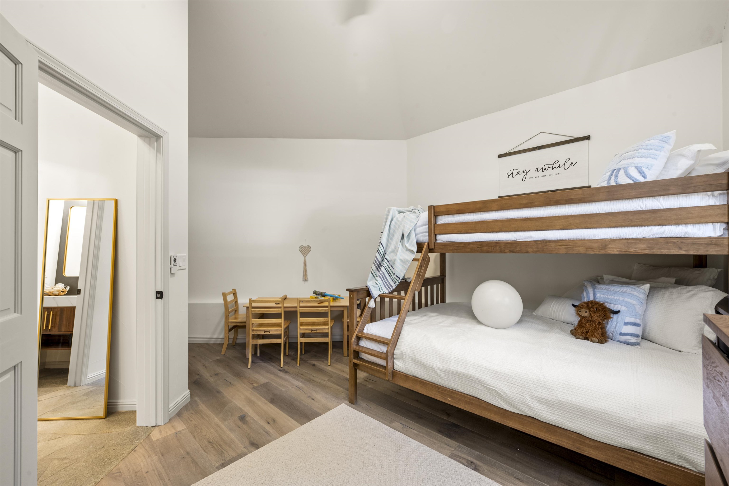 325 Winding Way Incline Village, NV 89451 - Photo 3 of 28 a bedroom with a bed and wooden floor