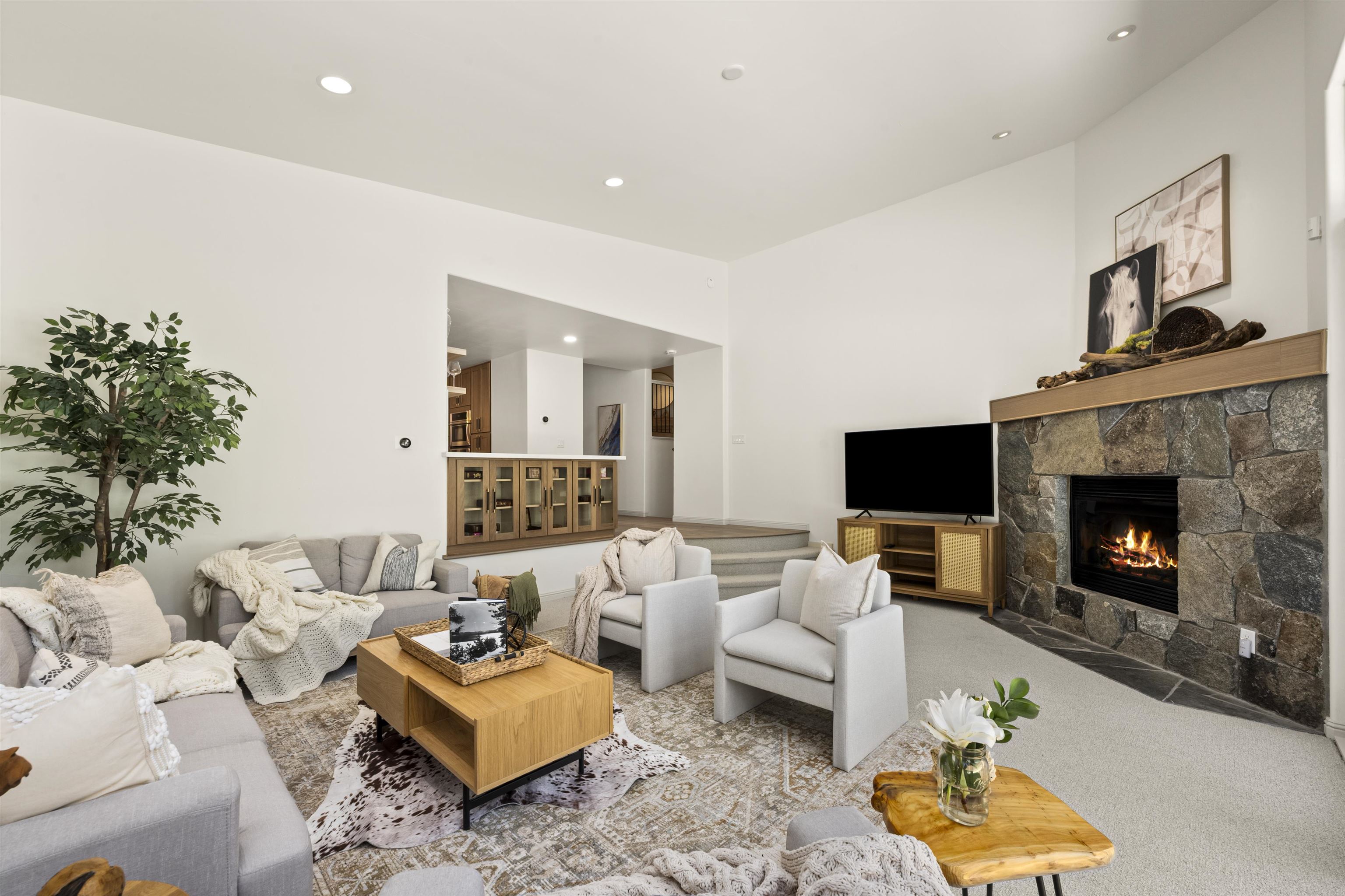 325 Winding Way Incline Village, NV 89451 - Photo 7 of 28 a living room with furniture a fireplace and a flat screen tv