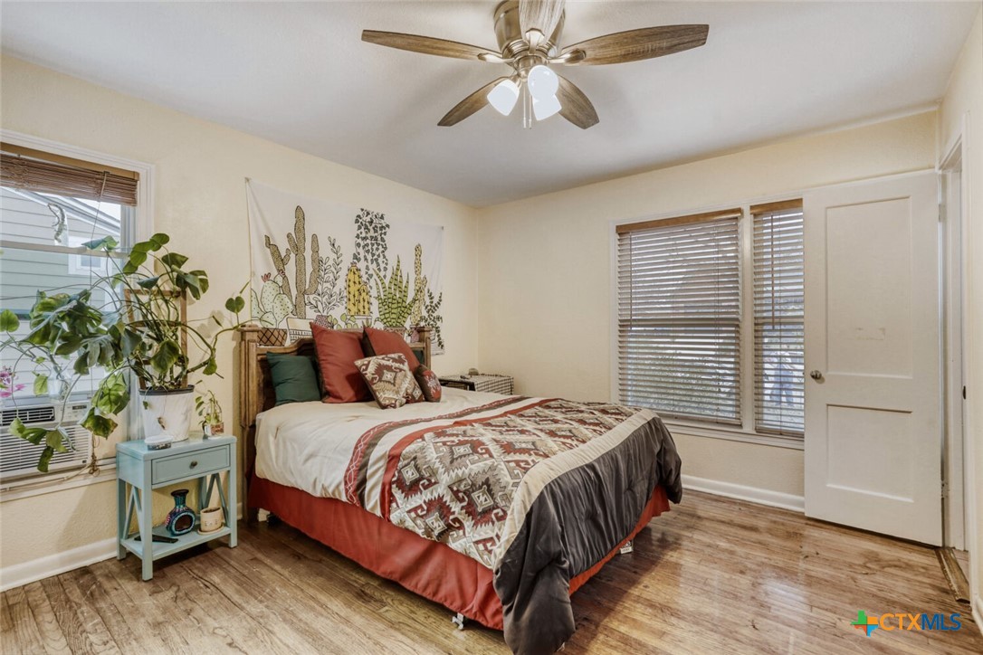 3307 Larry Lane Austin, TX 78722 - Photo 12 of 27 a bedroom with a bed and a window