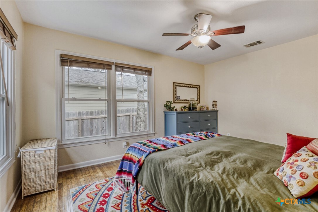 3307 Larry Lane Austin, TX 78722 - Photo 17 of 27 a bedroom with a bed and a window