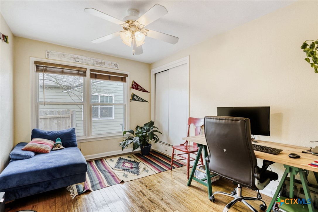 3307 Larry Lane Austin, TX 78722 - Photo 20 of 27 a living room with furniture and wooden floor