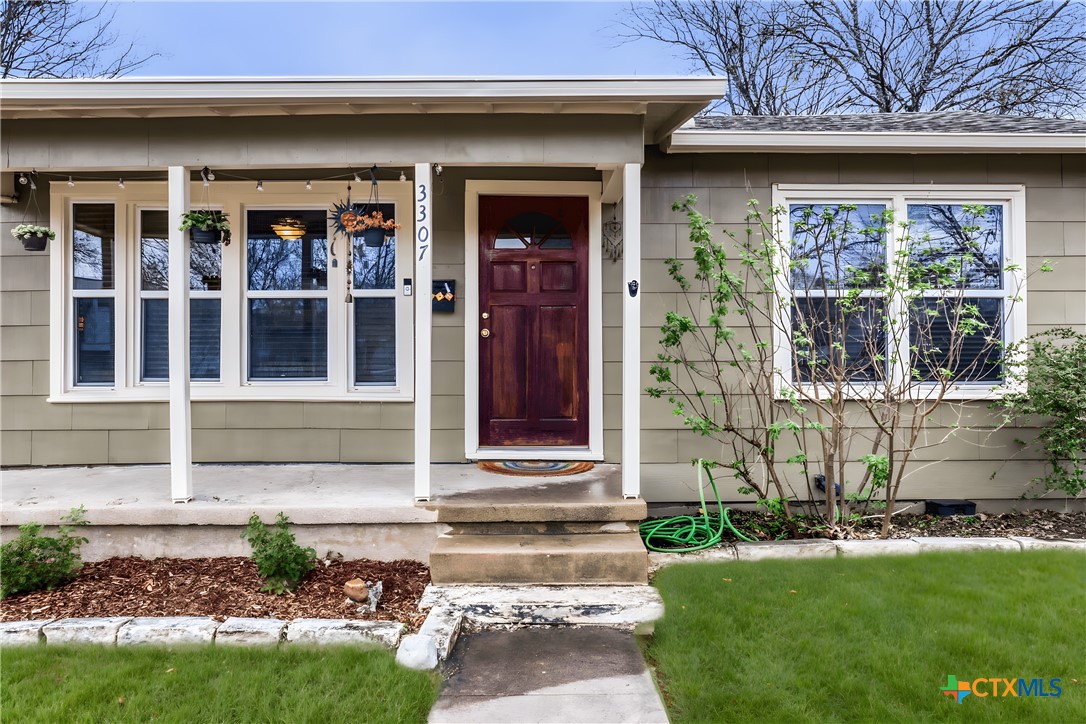 3307 Larry Lane Austin, TX 78722 - Photo 2 of 27 a front view of a house with a yard