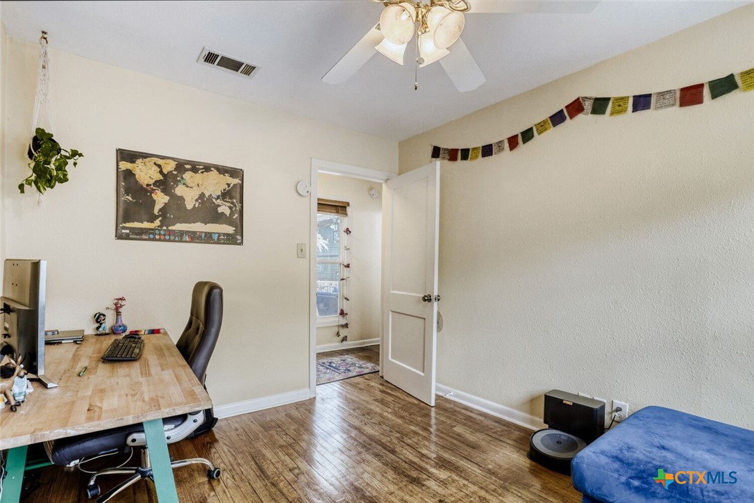 3307 Larry Lane Austin, TX 78722 - Photo 21 of 27 a view of a workspace with furniture and a window