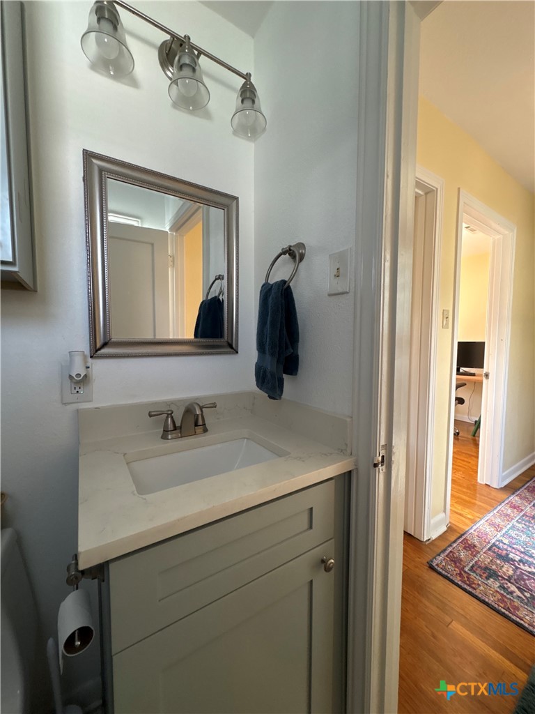3307 Larry Lane Austin, TX 78722 - Photo 27 of 27 a bathroom with a sink and a mirror