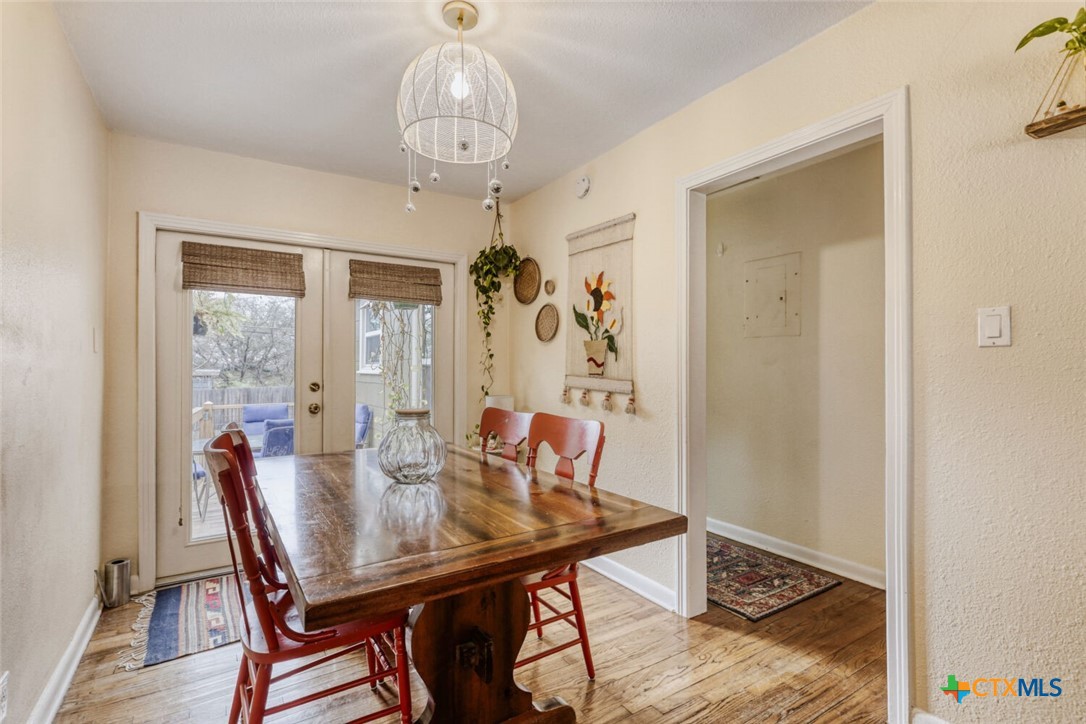 3307 Larry Lane Austin, TX 78722 - Photo 7 of 27 a view of a dining room with furniture window and wooden floor