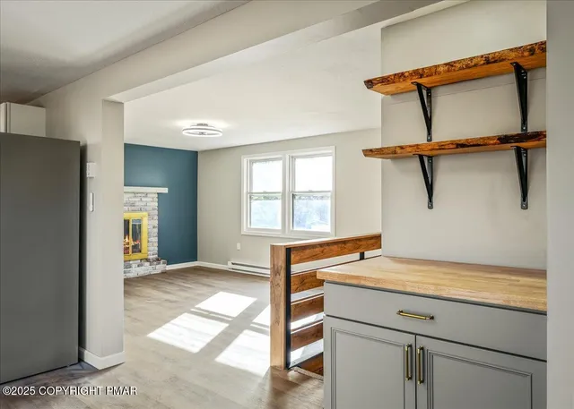 a view of entryway and kitchen