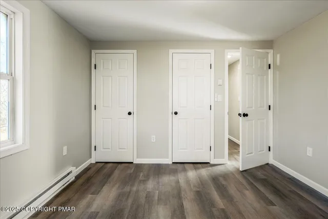 a view of an empty room and window