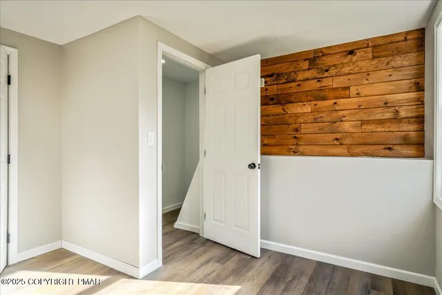 a view of entryway with wooden floor