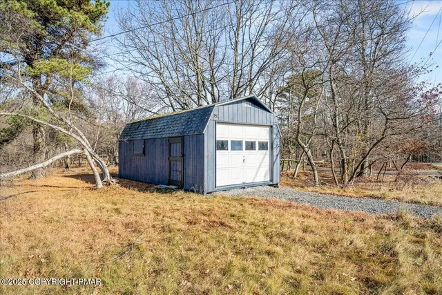 a large tree with wooden fence