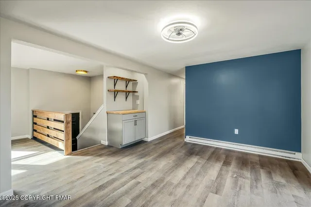 a view of workspace with wooden floor