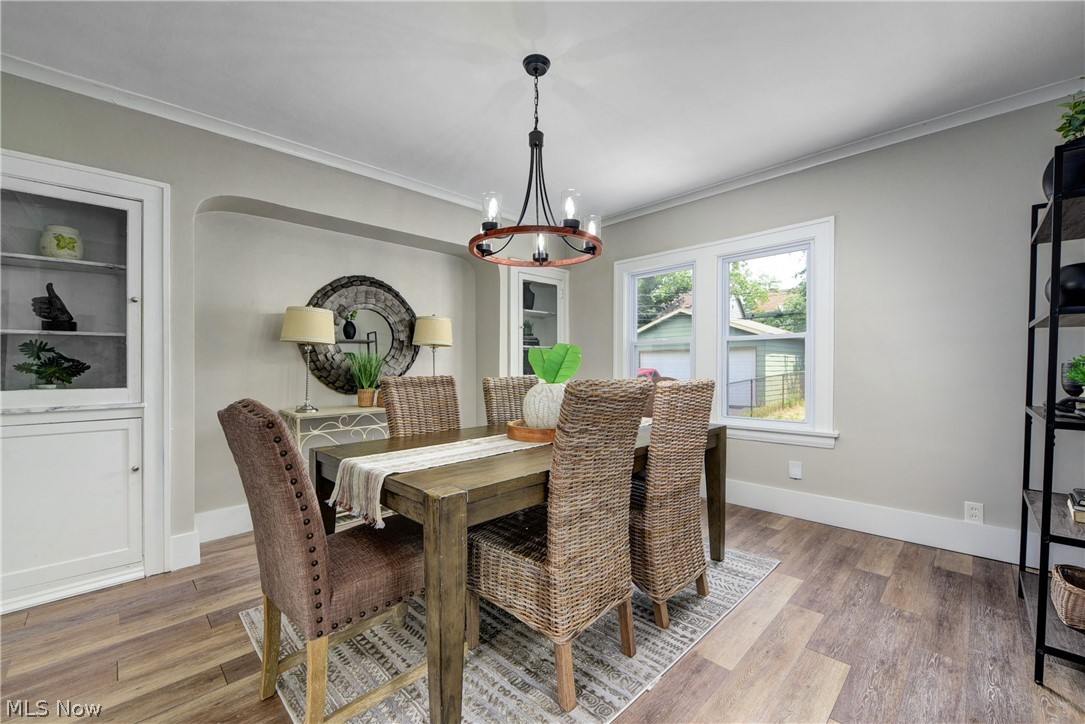 2115 Marlindale Road Cleveland Heights, OH 44118 - Photo 6 of 19 Dining space with an inviting chandelier, ornamental molding, and hardwood / wood-style floors