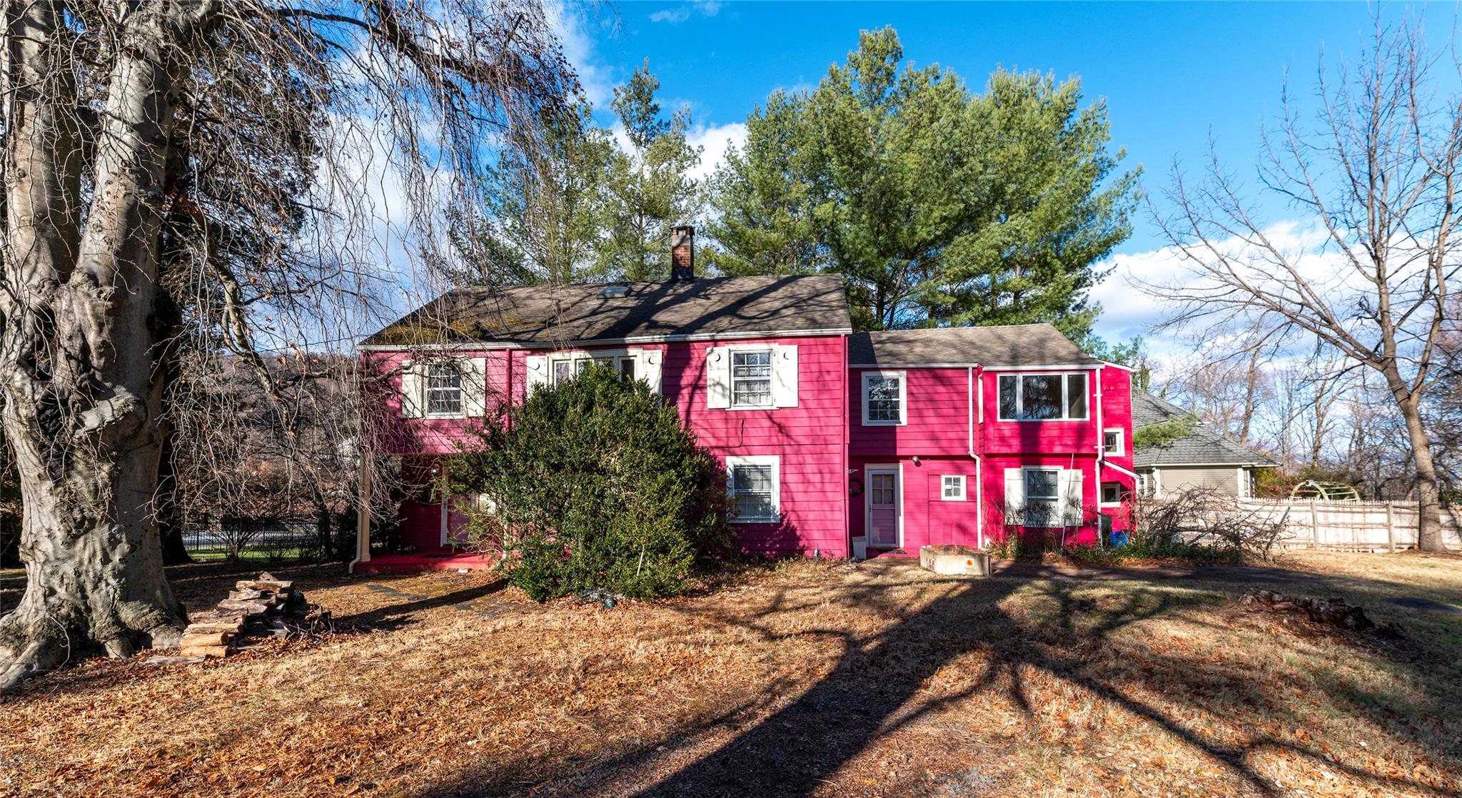 a street sign on a sidewalk next to a road