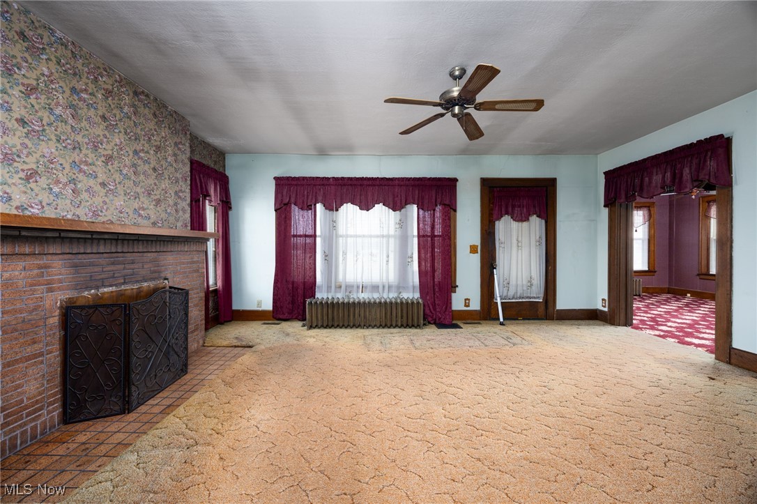 7908 Garman Road Burbank, OH 44214 - Photo 22 of 48 Living Room with decorative fireplace
