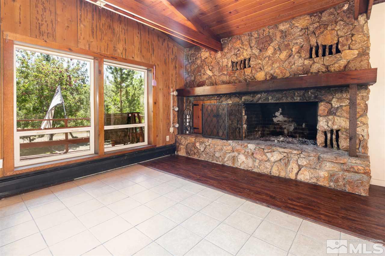 15871 Rocky Vista Road Reno, NV 89521 - Photo 8 of 33 a view of a fireplace and window in the room