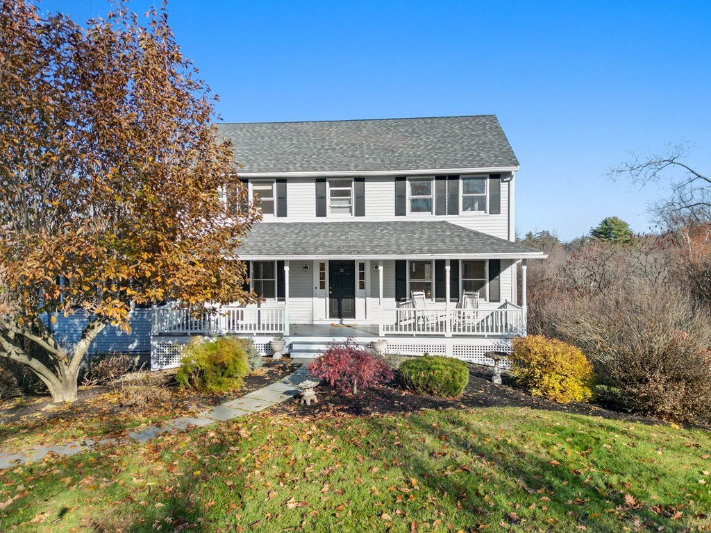 27 Brush Hill Road Merrimac, MA 01860 - Photo 1 of 26 a front view of a house with a yard table and chairs