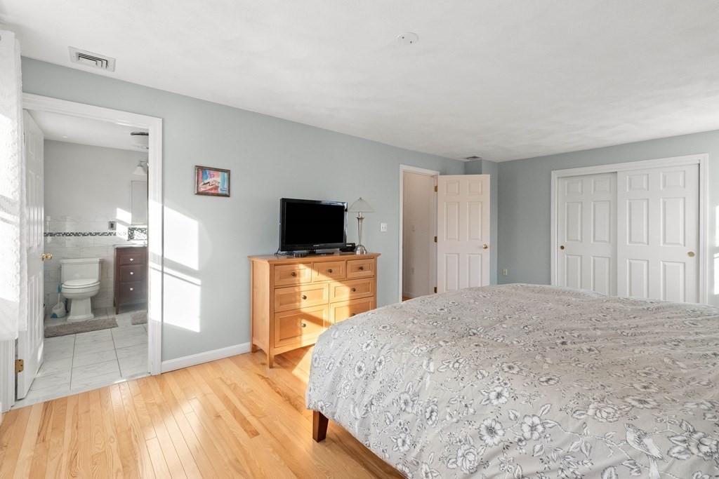 27 Brush Hill Road Merrimac, MA 01860 - Photo 13 of 26 a view of a livingroom with wooden floor and a flat screen tv