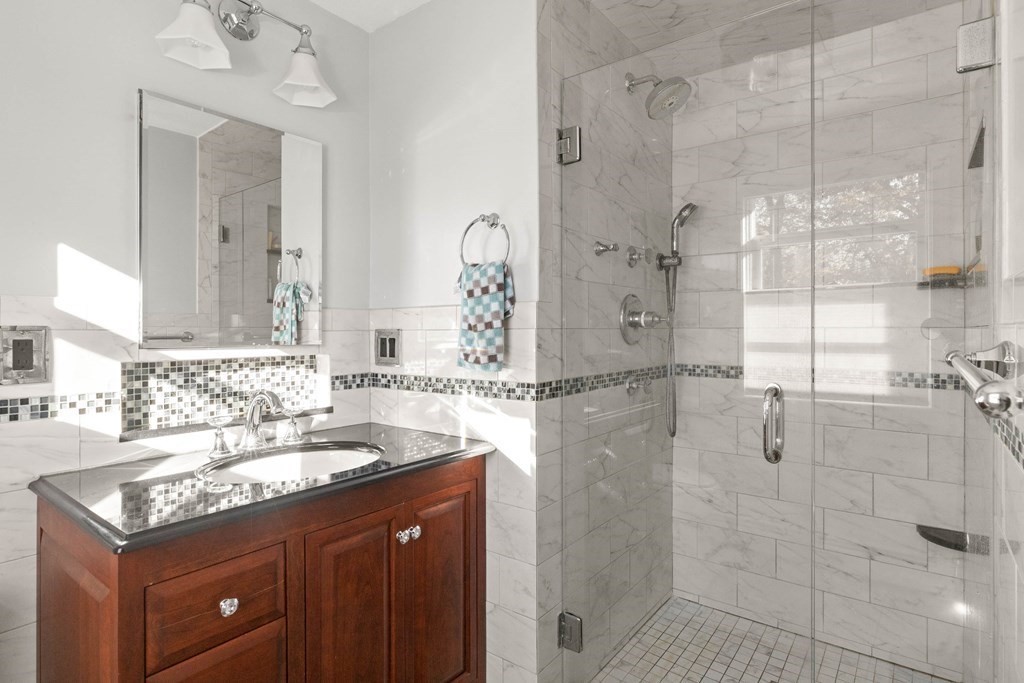 27 Brush Hill Road Merrimac, MA 01860 - Photo 14 of 26 a bathroom with a sink vanity granite shower and a mirror